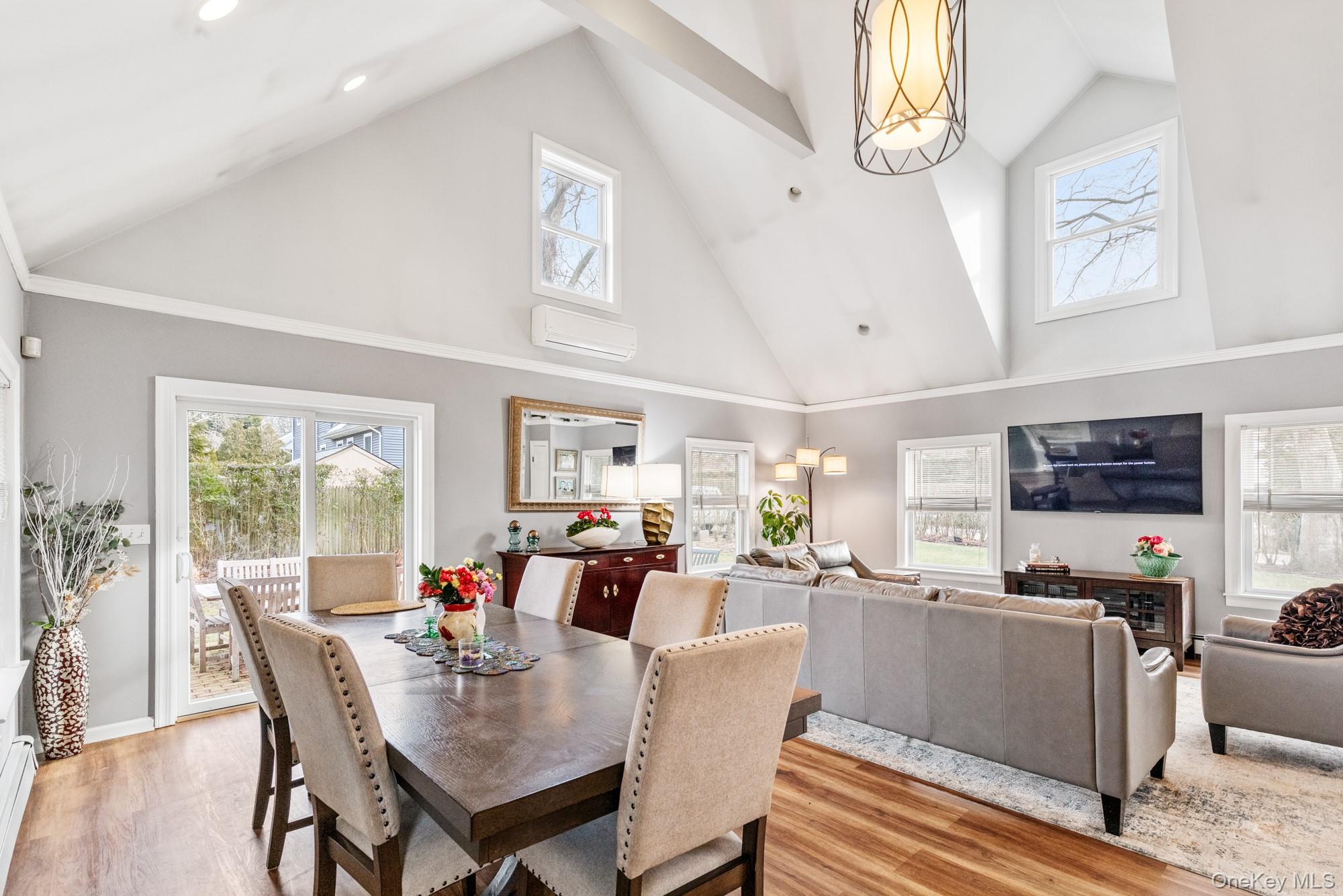 79 East Tiana Road Hampton Bays, NY 11946 - Photo 11 of 26 a view of a dining room with furniture window and outside view