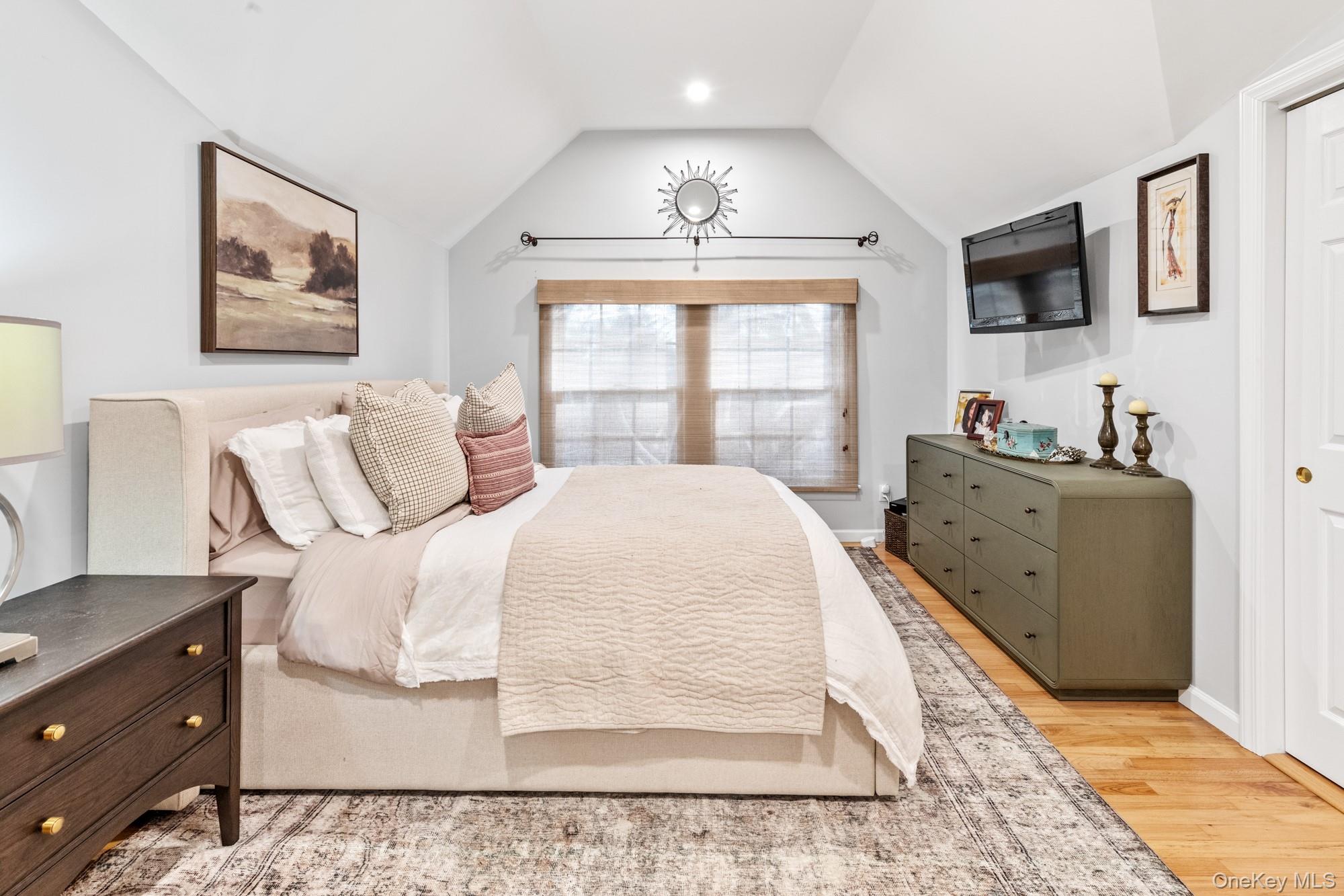 79 East Tiana Road Hampton Bays, NY 11946 - Photo 18 of 26 a bedroom with a bed and a window