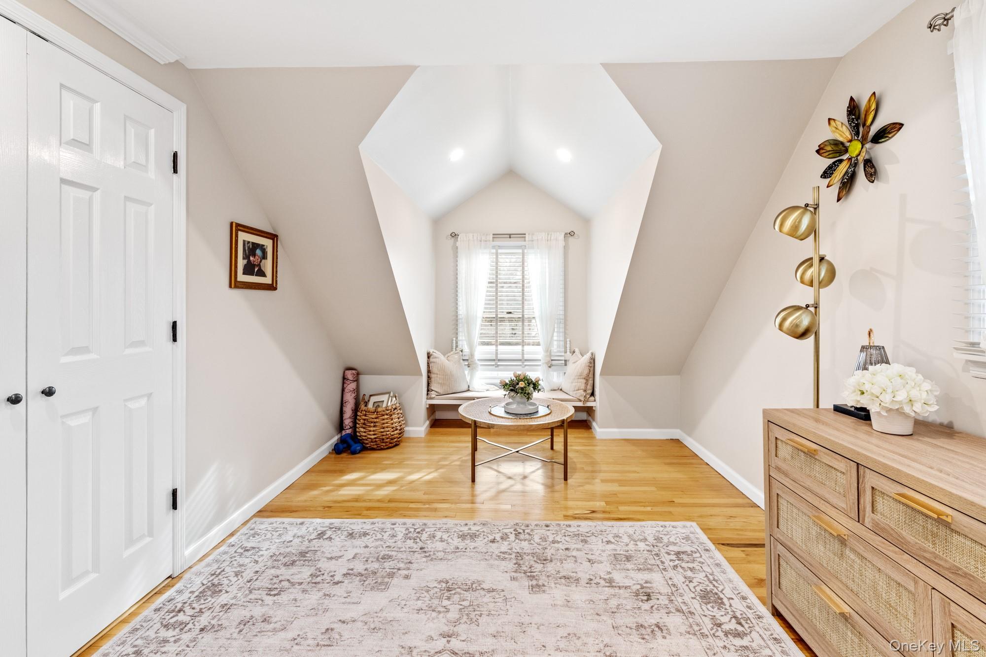 79 East Tiana Road Hampton Bays, NY 11946 - Photo 23 of 26 a living room with a couch and a table