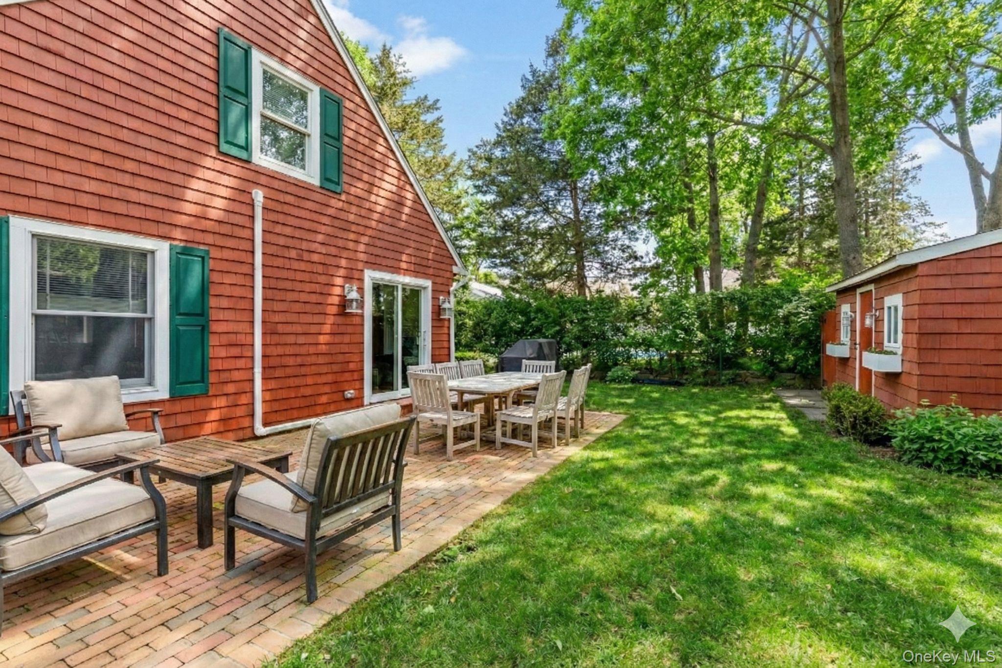 79 East Tiana Road Hampton Bays, NY 11946 - Photo 26 of 26 a view of a house with backyard and sitting area