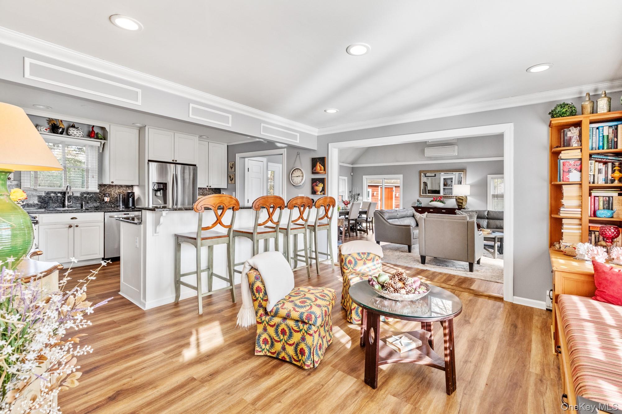 79 East Tiana Road Hampton Bays, NY 11946 - Photo 5 of 26 a living room with furniture and a wooden floor
