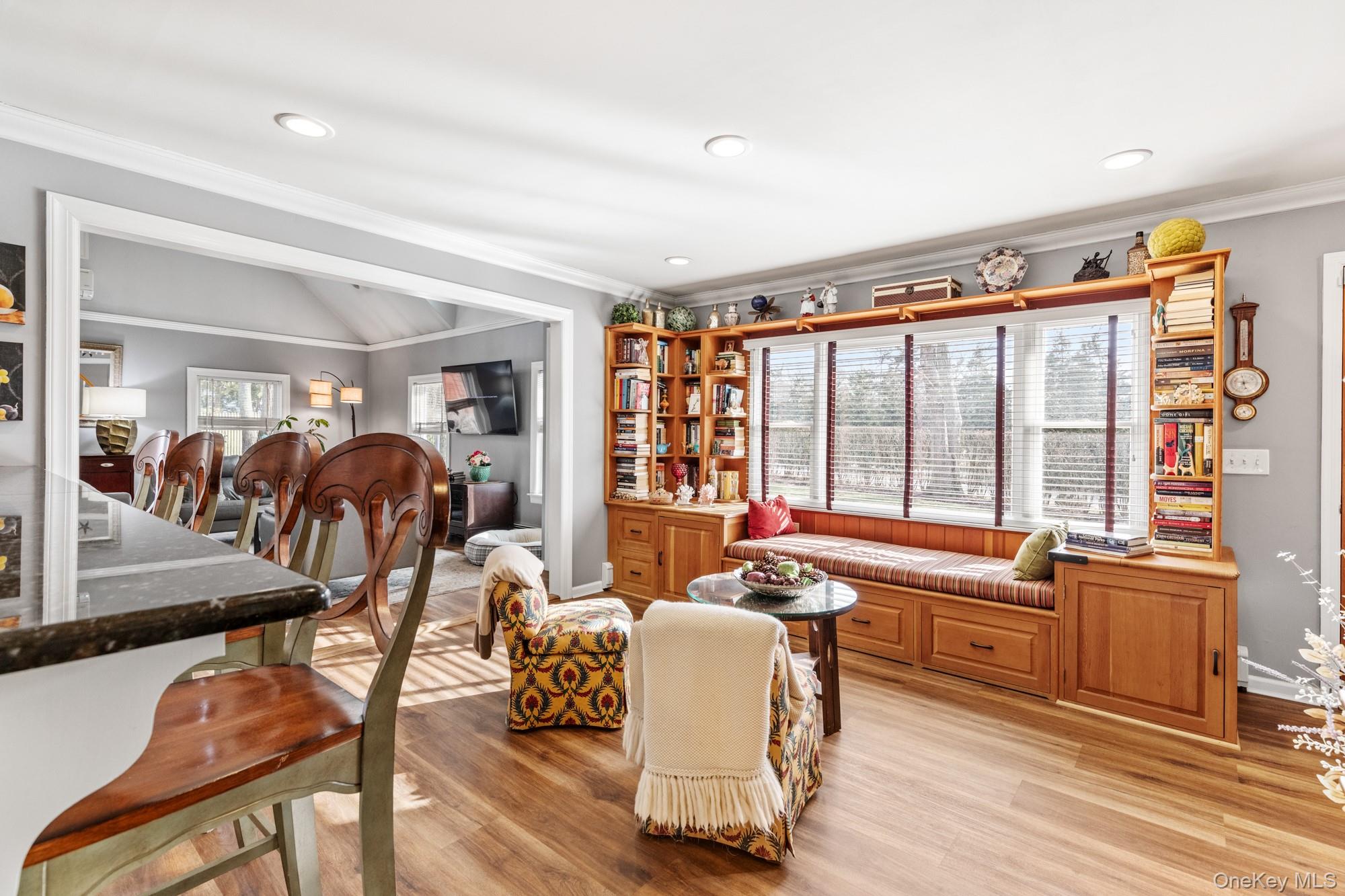 79 East Tiana Road Hampton Bays, NY 11946 - Photo 6 of 26 a living room with furniture and a large window