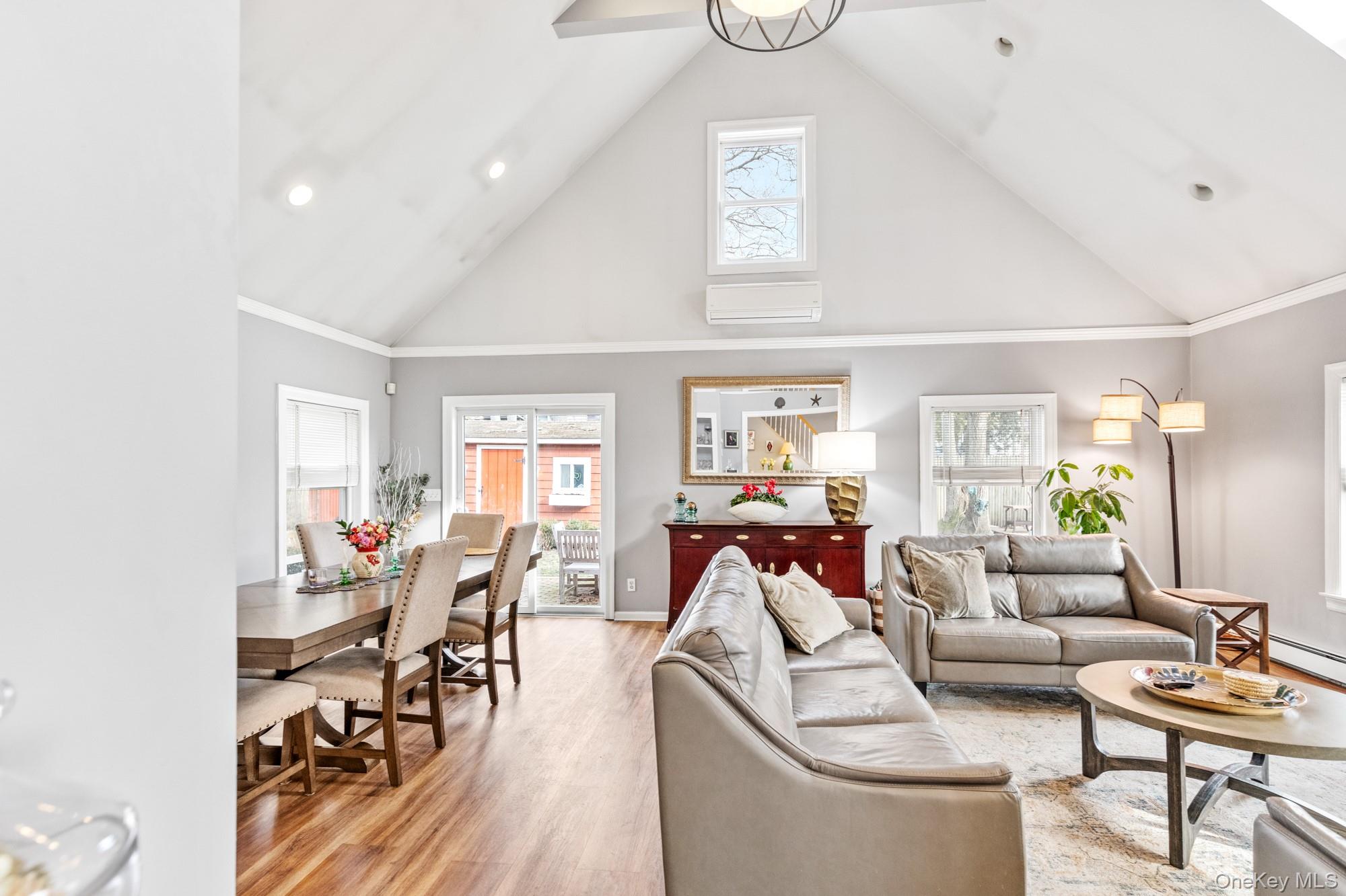 79 East Tiana Road Hampton Bays, NY 11946 - Photo 8 of 26 a living room with furniture and a wooden floor
