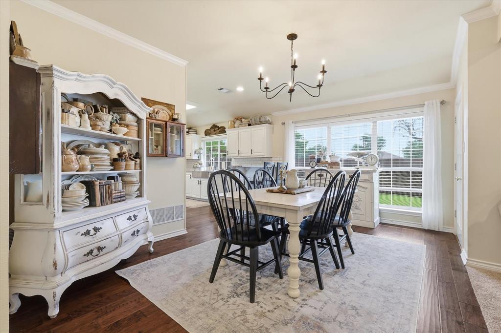 202 Colonial Heights Sanger, TX 76266 - Photo 8 of 27 a view of a dining room with furniture window and wooden floor