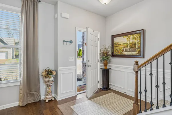 a kitchen with granite countertop stainless steel appliances a refrigerator sink and microwave