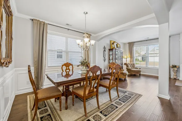 a kitchen with stainless steel appliances granite countertop a stove top oven a sink dishwasher and a microwave oven on the blue kitchen countertops