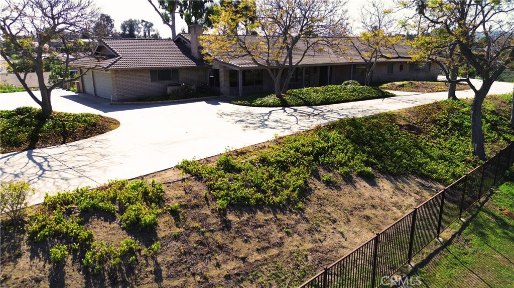 a view of a house with a yard covered in snow