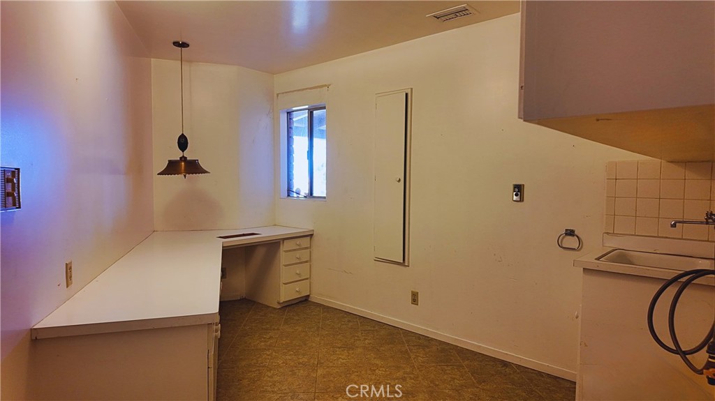 17250 Waugh Ranch Road Riverside, CA 92503 - Photo 15 of 16 a bathroom with a sink and a mirror