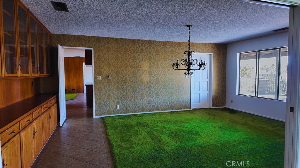 17250 Waugh Ranch Road Riverside, CA 92503 - Photo 8 of 16 a view of a kitchen with a fridge and a ceiling fan