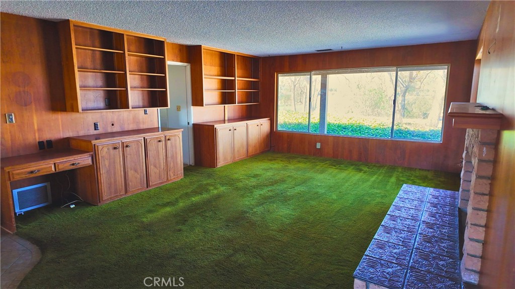 17250 Waugh Ranch Road Riverside, CA 92503 - Photo 10 of 16 a kitchen with stainless steel appliances a large window in it