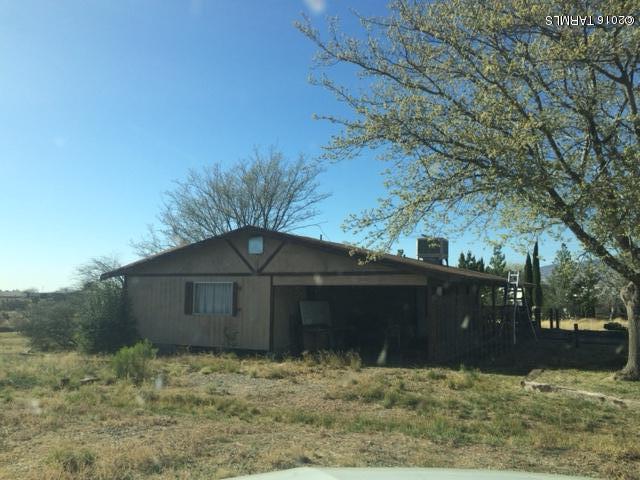 331 North Pima Benson, AZ 85602 - Photo 2 of 7 a backyard of a house with large trees