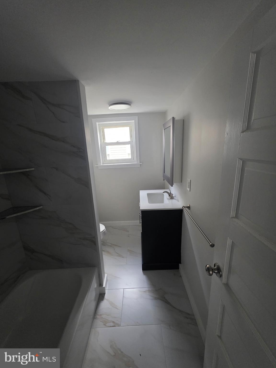 105 Mecray Lane Maple Shade, NJ 08052 - Photo 11 of 12 a bathroom with a sink and a mirror