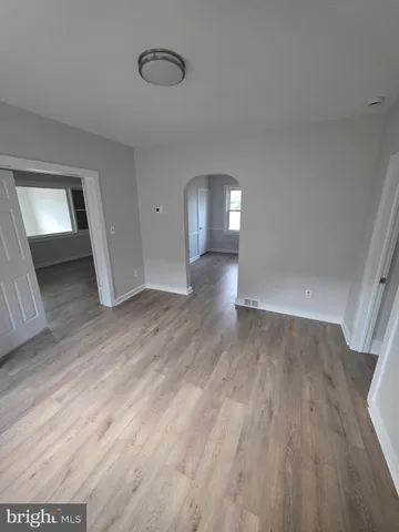 wooden floor in a hall with an entryway