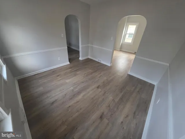 wooden floor in a hall with an entryway