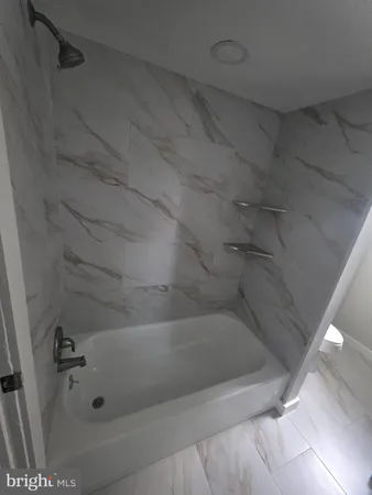 a close view of a bathtub in bathroom