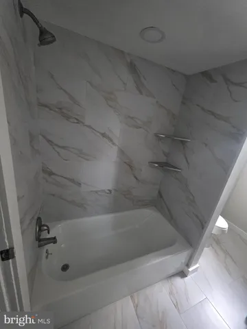 a close view of a bathtub in bathroom