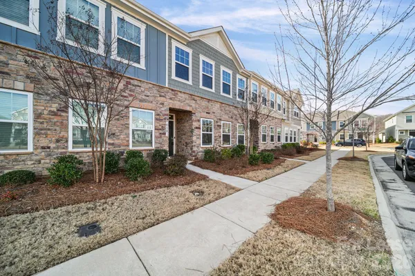 a view of a brick building next to a road