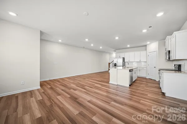a view of kitchen and kitchen with furniture