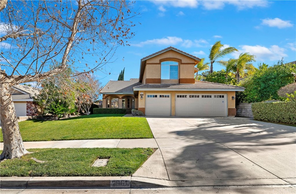 2961 Alps Road Corona, CA 92881 - Photo 1 of 1 a front view of a house with a yard and garage