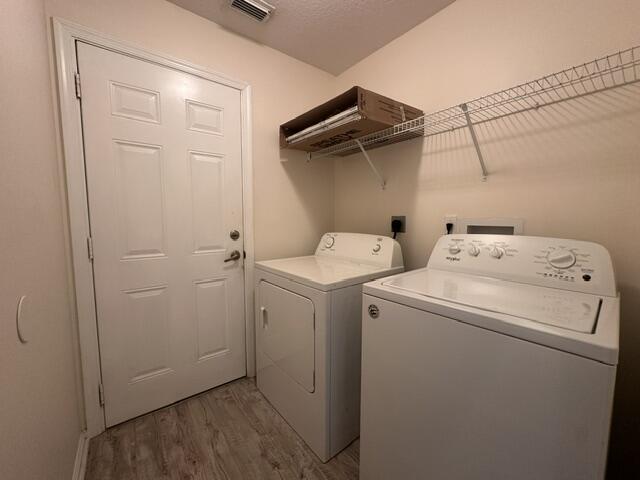 519 Southwest Laconic Avenue Port St. Lucie, FL 34953 - Photo 9 of 10 a utility room with dryer and washer