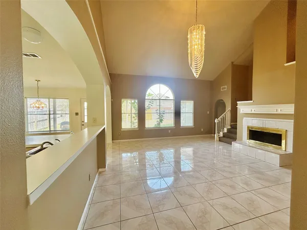 a large spacious bathroom with a large mirror vanity and bathtub