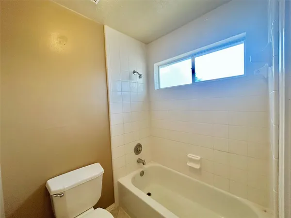 an empty room with a empty space and a window