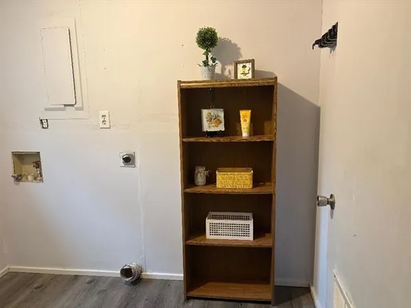 a view of a hallway with washer and dryer