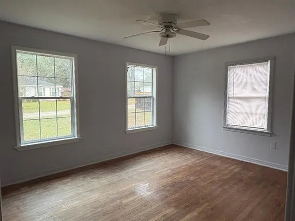 a view of an empty room with a window