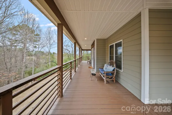 a view of a house with pool and sitting area