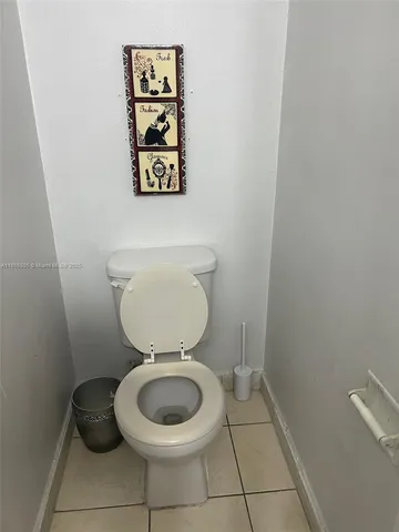 a bathroom with a toilet and a sink