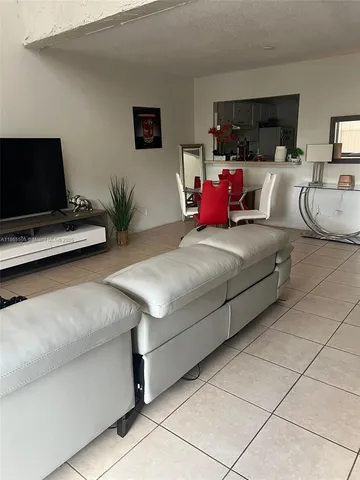 a bedroom with bed and a couch