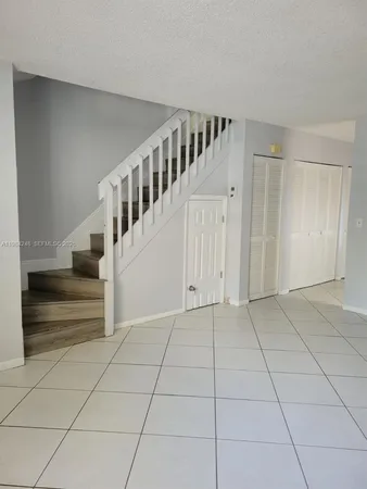 a view of an entryway with white walls