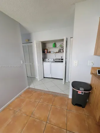 a room with a cabinets and dust bin