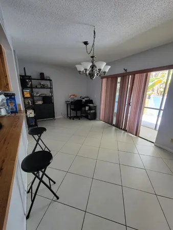 a view of a livingroom with furniture and a ceiling fan
