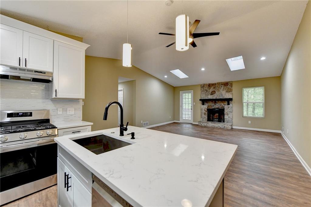 1490 Meadowlark Drive Decatur, GA 30032 - Photo 1 of 1 a kitchen with sink a stove and oven