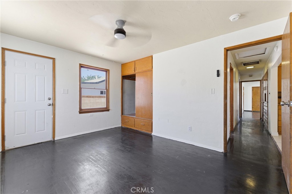 44509 Date Lancaster, CA 93534 - Photo 3 of 20 an empty room with wooden floor and windows