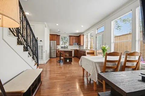 a view of entryway and hall with wooden floor