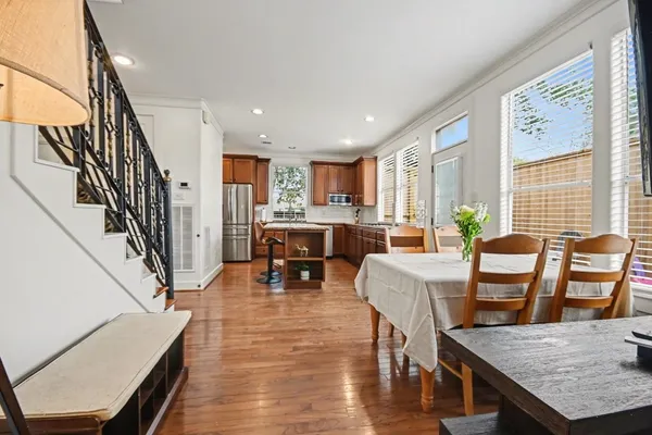 a view of entryway and hall with wooden floor