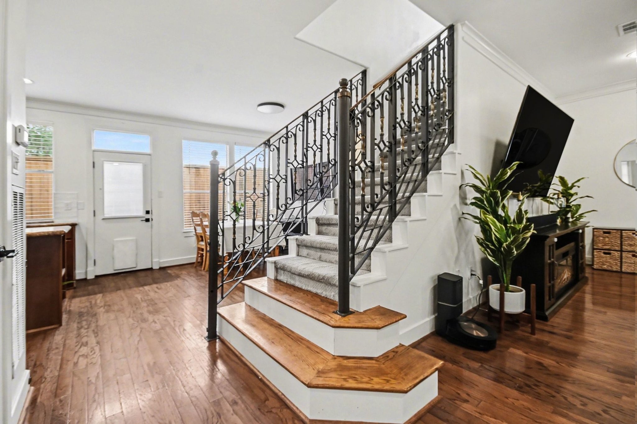 1470 Springrock Lane, Unit 6 Houston, TX 77055 - Photo 12 of 32 Elegant iron railing staircase leads to the second floor.
