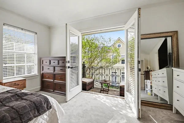 a bedroom with furniture and a window
