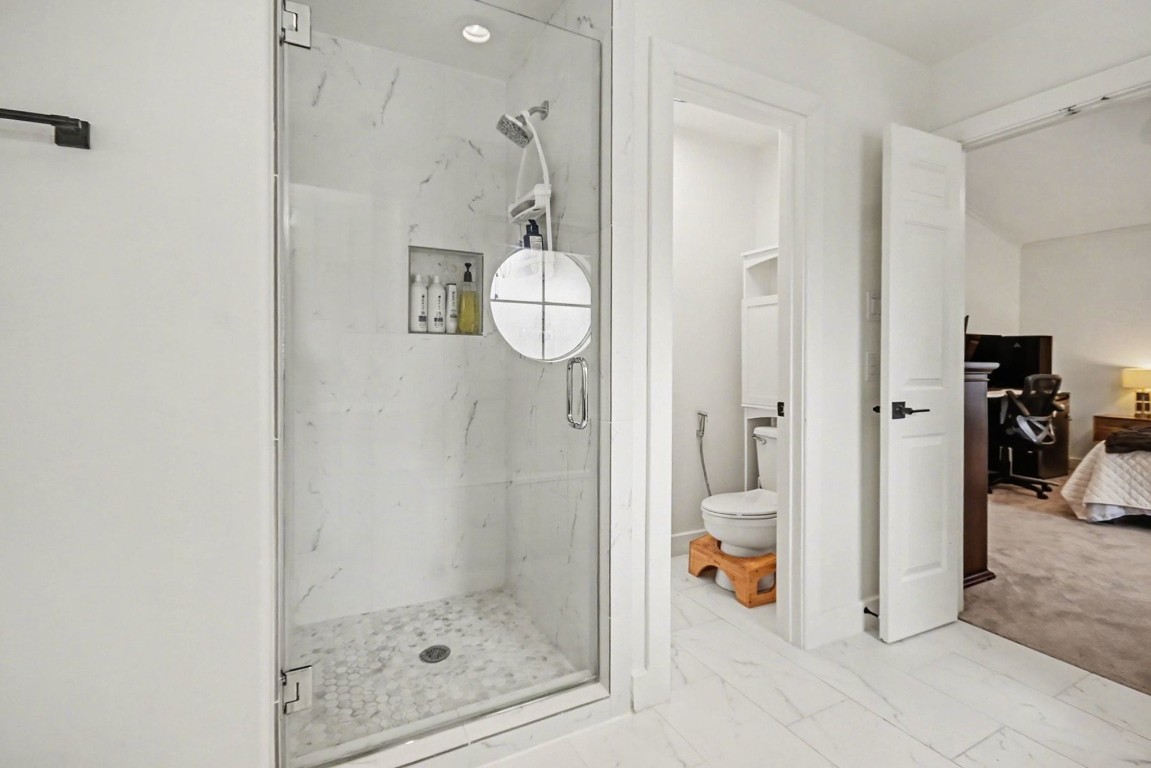 1470 Springrock Lane, Unit 6 Houston, TX 77055 - Photo 18 of 32 Walk-in shower with built-in storage for toiletries.