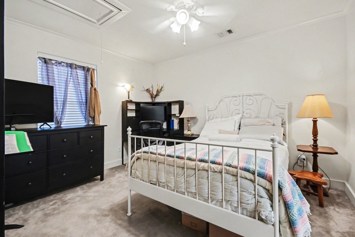 1470 Springrock Lane, Unit 6 Houston, TX 77055 - Photo 21 of 32 a bedroom with furniture and a flat screen tv