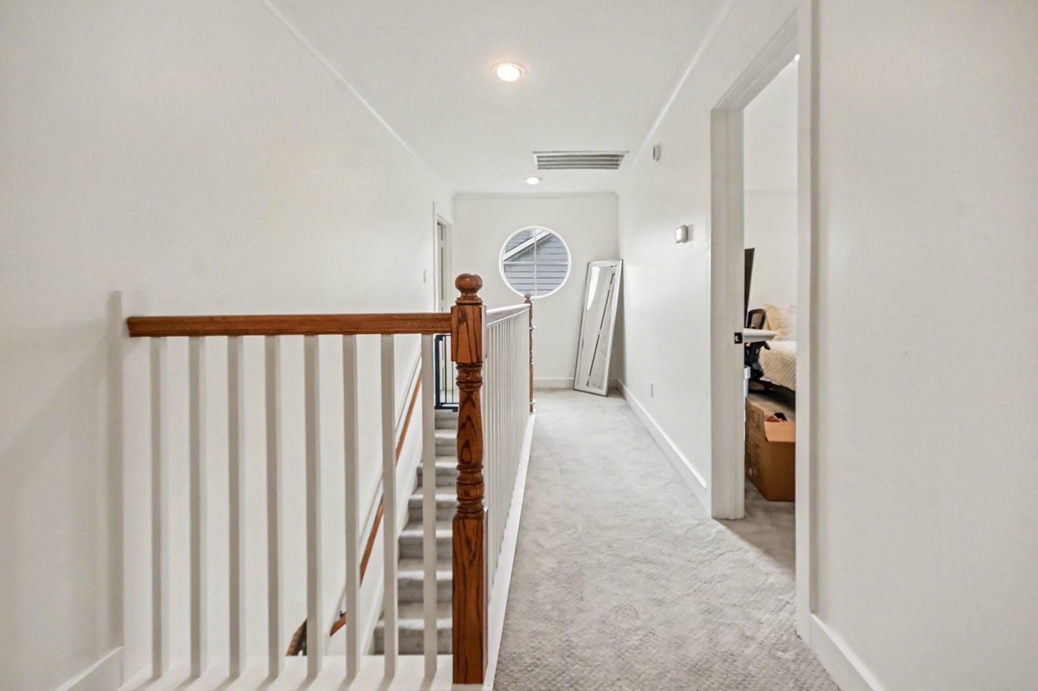 1470 Springrock Lane, Unit 6 Houston, TX 77055 - Photo 24 of 32 Landing area for stairway leading to bedrooms.