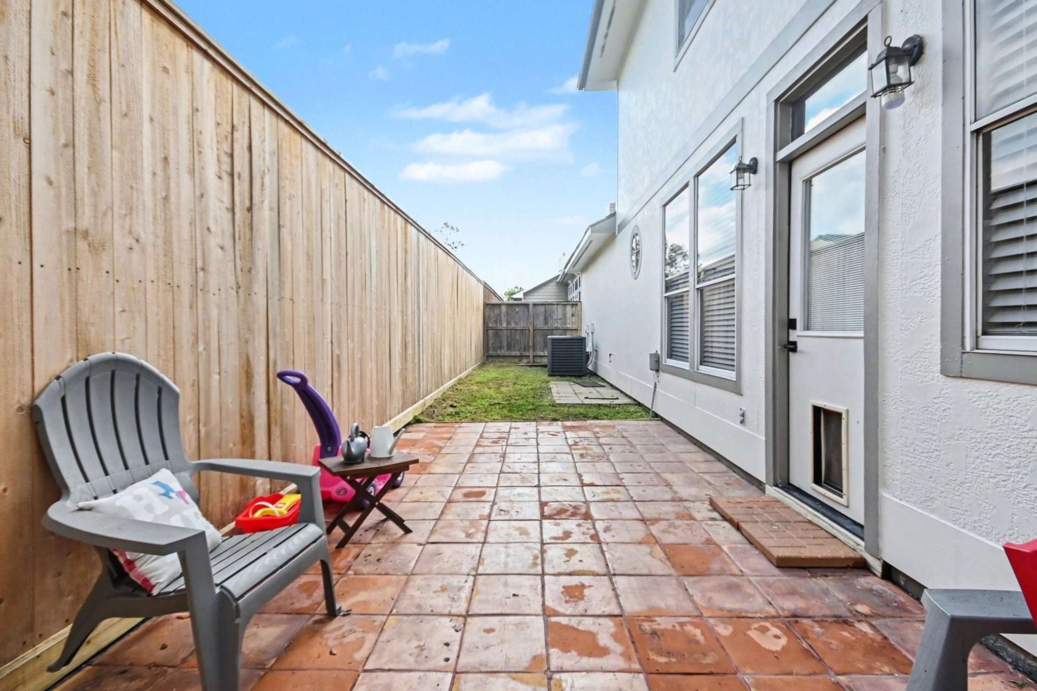 1470 Springrock Lane, Unit 6 Houston, TX 77055 - Photo 28 of 32 Private backyard with new fencing featuring a patio and green space.