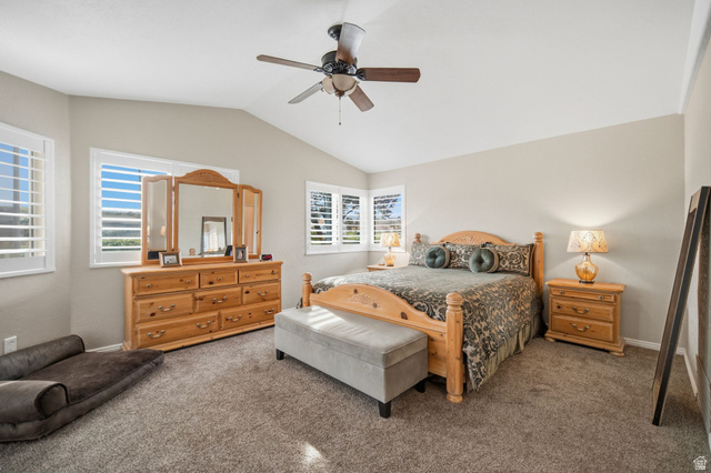 1985 West Rivers Edge Lane St. George, UT 84770 - Photo 22 of 42 Bedroom with dark carpet, vaulted ceiling, and ceiling fan