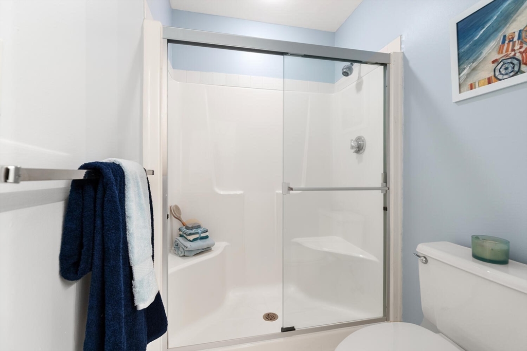100 Rosemary Way, Unit 325 Needham, MA 02494 - Photo 13 of 24 a bathroom with a shower and a toilet