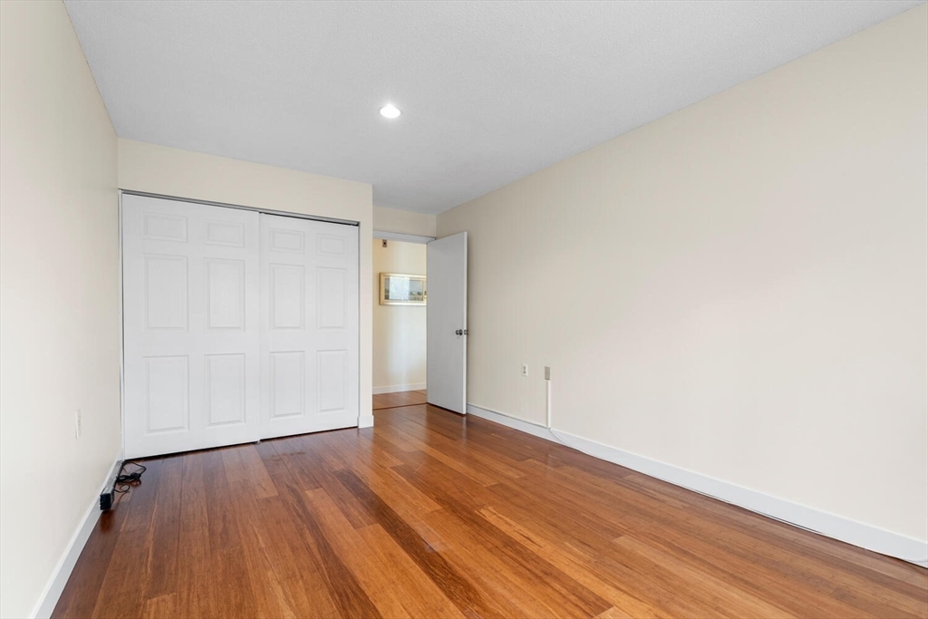100 Rosemary Way, Unit 325 Needham, MA 02494 - Photo 14 of 24 a view of an empty room with wooden floor