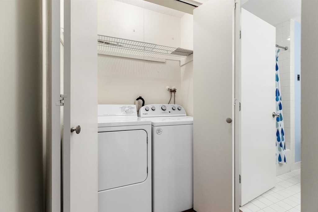 100 Rosemary Way, Unit 325 Needham, MA 02494 - Photo 15 of 24 a utility room with dryer and washer