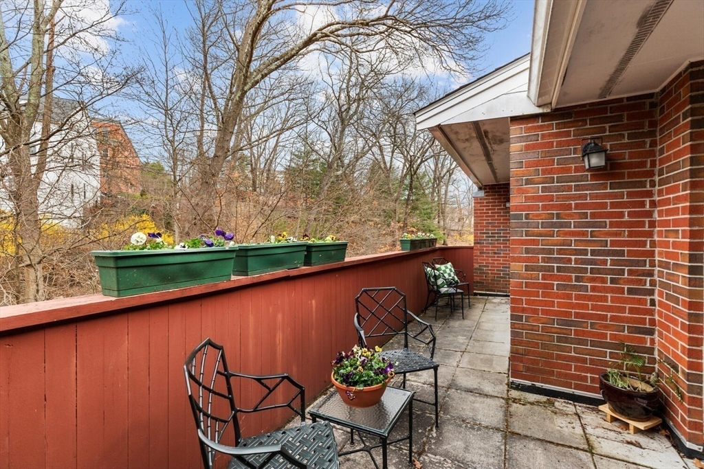100 Rosemary Way, Unit 325 Needham, MA 02494 - Photo 18 of 24 a view of a chairs and table in patio