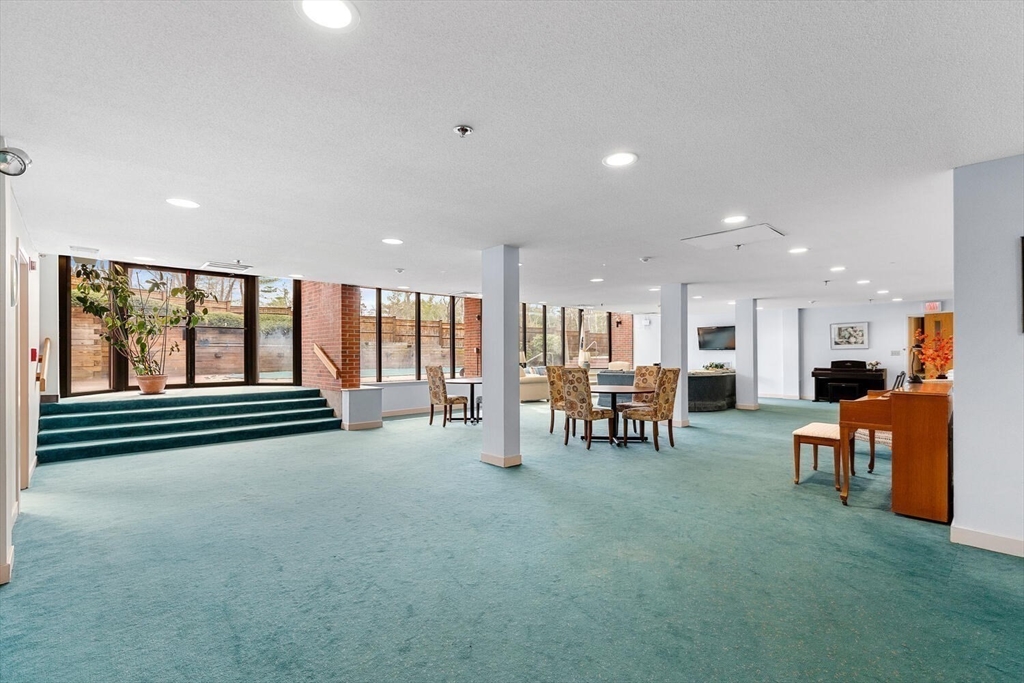 100 Rosemary Way, Unit 325 Needham, MA 02494 - Photo 19 of 24 a view of game room with table and chairs